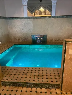 a large swimming pool in a room with at Riyad piscine intérieure privative in Marrakech