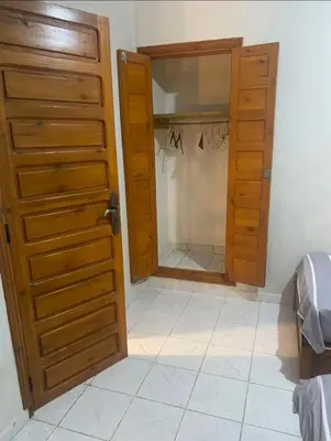 a room with a closet with a open door at Riyad piscine intérieure privative in Marrakech
