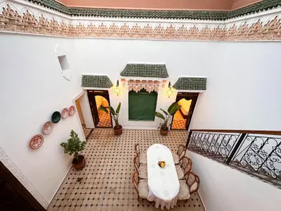 an overhead view of a living room with a table at Riad M Azbetz in Marrakech