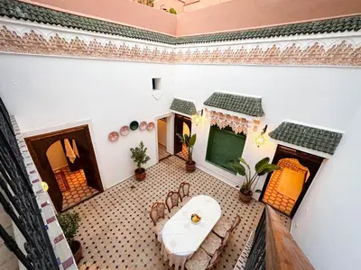 an overhead view of a living room with a fireplace at Riad M Azbetz in Marrakech