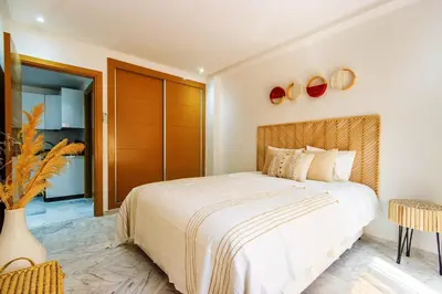 a bedroom with a large bed in a room at Bohemian Style in hyper-center - Wifi in Marrakech