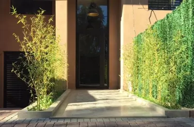 a door to a building with a brick walkway at Sumptuous appart Heart of Hivernage - Pool in Marrakech