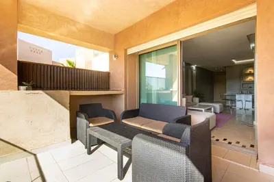 a living room with a couch and chairs at Relaxation et Confort a Prestigia -10 min du centre in Marrakech