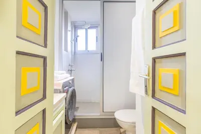 a bathroom with a toilet and a window at Romantic Retreat next to M avenue in Marrakech