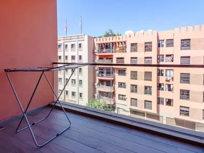 a metal object on a balcony with a building at Style et Comfortable au Centre de la Ville in Marrakech
