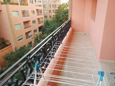 an overlook of a balcony of a building at Family Apartment with Pool in Marrakech