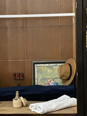 a hat sitting on top of a bed in a room at Riad Jasmine SYBA in Marrakech