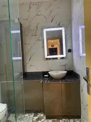 a bathroom with a sink and a mirror at appartement in Marrakech