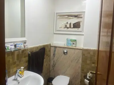 a bathroom with a sink and a toilet and a mirror at Marrakech 2 in Marrakech