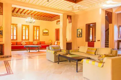 a large living room with couches and a table at Villa 36 Amelkis - Pool & Garden in Marrakech