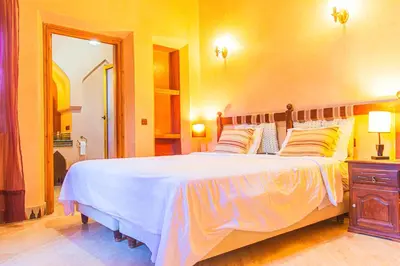 a bedroom with a large bed in a room at Villa 36 Amelkis - Pool & Garden in Marrakech