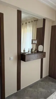 a bathroom with a large mirror and a counter at Le Marrakchi - 2 chambres - Parking - Wifi in Marrakech