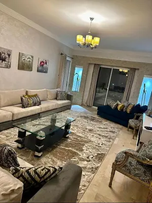 a living room with a couch and a table at Apartment in Marrakech equipped and comfortable in Marrakech