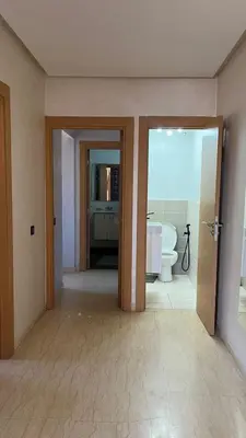 an empty bathroom with a toilet and a tub at Etoile rouge in Marrakech