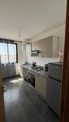 a kitchen with a sink and a stove at Etoile rouge in Marrakech