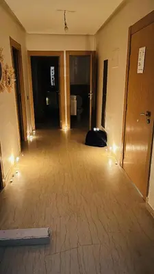 a hallway of a hotel room with a bag on the floor at Etoile rouge in Marrakech