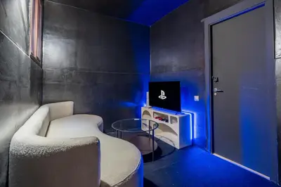 a room with a couch and a tv and a door at Villa Waky Confort & Relax in Marrakech