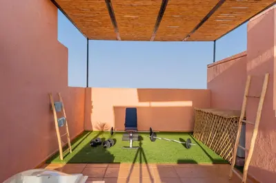 a bathroom with a sink and a chair in a room at Villa Waky Confort & Relax in Marrakech
