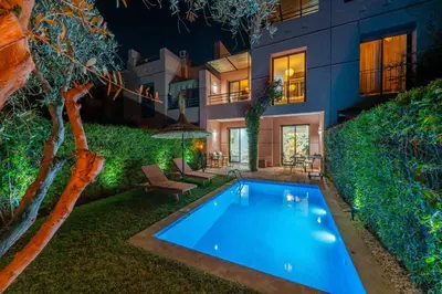 a swimming pool in the yard of a house at Villa Waky Confort & Relax in Marrakech