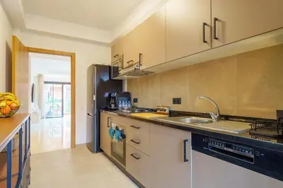 a kitchen with a sink and a counter top at Appartement Moderne, Vue Atlas & Piscine, Noria in Marrakech
