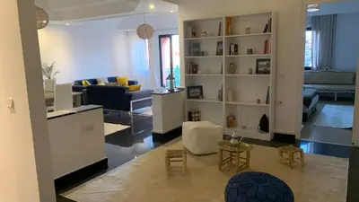 a living room with a couch and a table at Appartement au cœur de Marrakech in Marrakech
