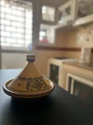 a vase sitting on top of a table at Appartement Cosy & Calme à Izdihar Confort Assuré in Marrakech