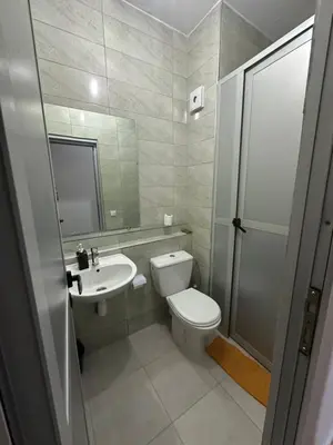 a bathroom with a toilet and a sink at Appartement Cosy & Calme à Izdihar Confort Assuré in Marrakech
