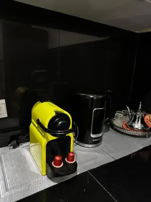 a yellow toaster sitting on top of a counter at Appartement Centre Gare gueliz chic et cosy de Marrakech in Marrakech