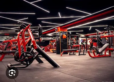 a gym with a bunch of equipment in it at Appartement Centre Gare gueliz chic et cosy de Marrakech in Marrakech
