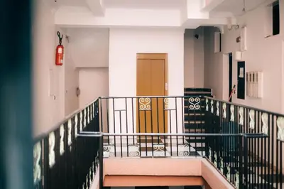 a stairway with a yellow door in a building at Apart Hotel Larabi in Marrakech