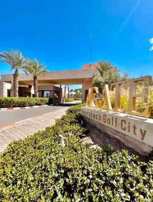 a sign for the entrance to a student golf city at Appartement de vacances à Prestigia golf city rez jardin in Marrakech