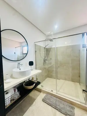 a bathroom with a shower and a sink and a mirror at Magnifique 1 Room WIFI en plein coeur de GUELIZ in Marrakech