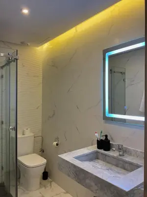 a bathroom with a sink and a toilet and a mirror at MARRAKECH Palmeraie Gates in Marrakech
