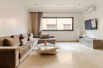 a living room with a couch and a coffee table at Cozy Studio in city center Guéliz in Marrakech