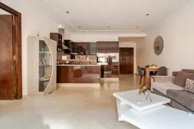 a living room with a couch and a table at Cozy Studio in city center Guéliz in Marrakech