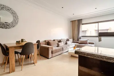 a living room with a couch and a table at Cozy Studio in city center Guéliz in Marrakech