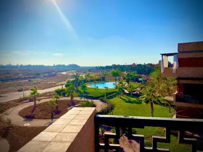 a view of a swimming pool from a building at cozy appartement in Marrakech