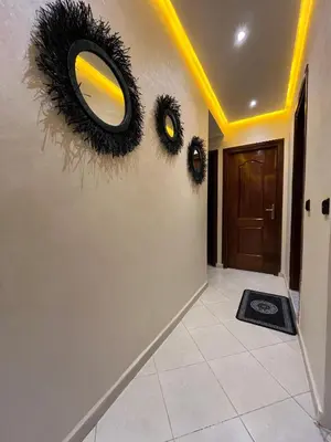 a hallway with a mirror with eyes on the wall at Cozy Apartment Near Airport in Marrakech
