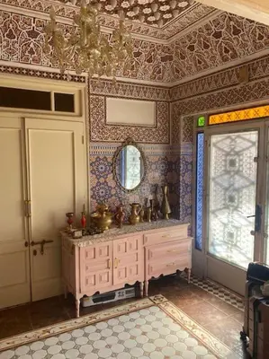 a bathroom with a sink and a mirror at La porte d Or in Marrakech