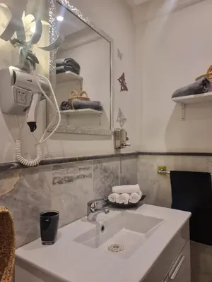 a bathroom with a sink and a mirror at Shine house in Marrakech