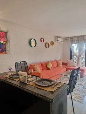 a living room with a couch and a table at Shine house in Marrakech