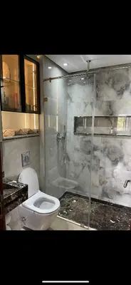 a bathroom with a toilet and a shower at Appartement Marrakech prestigia by Sofia 2 chambres piscine in Marrakech