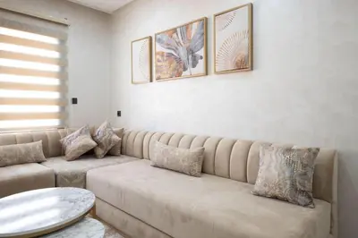 a living room with a couch and a table at Studio moderne à deux pas du coeur de la ville in Marrakech