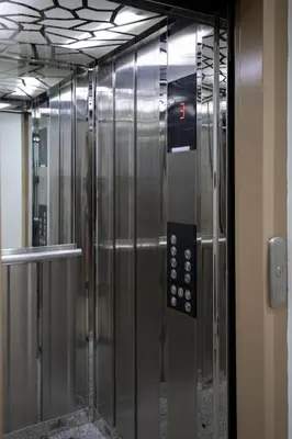 a elevator with a glass door with a remote control at Studio moderne à deux pas du coeur de la ville in Marrakech