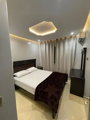 a bedroom with a bed and a television in it at Assala GUÉLIZ in Marrakech