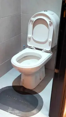 a toilet with the seat up in a bathroom at Assala GUÉLIZ in Marrakech