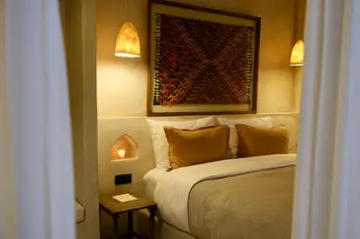 a hotel room with a bed and a picture on the wall at Riad Solange in Marrakech