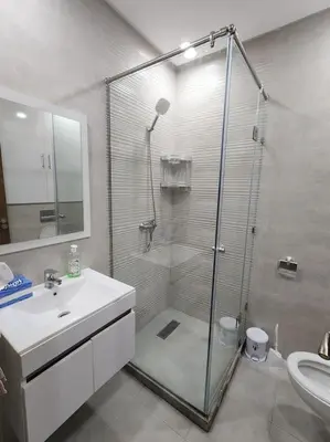 a bathroom with a shower and a sink and a toilet at Évasion élégante à Marrakech in Marrakech