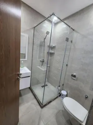 a bathroom with a shower with a toilet and a sink at Évasion élégante à Marrakech in Marrakech