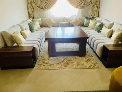 a living room with a couch and a coffee table at Nomad's Cosy Apartment Gueliz Center in Marrakech